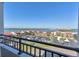 Balcony view shows the community's lush landscaping, ocean, and surrounding buildings on a clear day at 855 Bayway Blvd # 703, Clearwater Beach, FL 33767