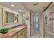 Well-lit bathroom with spacious shower, marble countertop and modern sink at 855 Bayway Blvd # 703, Clearwater Beach, FL 33767