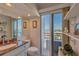A bathroom features a granite vanity, toilet, and a sliding glass door with an ocean view at 855 Bayway Blvd # 703, Clearwater Beach, FL 33767