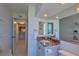 A bright bathroom with granite vanity and views of the gulf coast at 855 Bayway Blvd # 703, Clearwater Beach, FL 33767