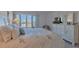Serene bedroom with large window and a glimpse of the waterfront at 855 Bayway Blvd # 703, Clearwater Beach, FL 33767