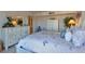 Comfortable bedroom with large cabinets for storage and accent decor at 855 Bayway Blvd # 703, Clearwater Beach, FL 33767