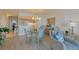 Inviting dining area with water views, an adjacent kitchen, and a comfortable seating area at 855 Bayway Blvd # 703, Clearwater Beach, FL 33767