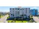 Modern condo building with lush landscaping, ample parking and conveniently located near local beaches at 855 Bayway Blvd # 703, Clearwater Beach, FL 33767