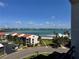 Scenic exterior view overlooking the community, beach, and ocean views with bright sunny skies at 855 Bayway Blvd # 703, Clearwater Beach, FL 33767