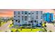 A beautiful condominium building with stunning architecture, lush landscaping, and convenient parking at 855 Bayway Blvd # 703, Clearwater Beach, FL 33767