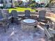 Cozy outdoor fire pit area with comfortable Adirondack chairs, perfect for relaxing evenings at 855 Bayway Blvd # 703, Clearwater Beach, FL 33767