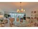 Bright living room area with water views, comfortable seating, large windows, and stylish decor at 855 Bayway Blvd # 703, Clearwater Beach, FL 33767