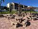 Large patio area with multiple tables and benches, perfect for outdoor dining and social gatherings at 855 Bayway Blvd # 703, Clearwater Beach, FL 33767