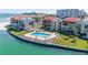 Beautiful condo pool featuring lounge chairs, umbrellas, and easy access to the beach at 855 Bayway Blvd # 703, Clearwater Beach, FL 33767