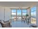 Relaxing sunroom with beautiful water views, perfect for enjoying morning coffee at 855 Bayway Blvd # 703, Clearwater Beach, FL 33767