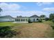 View of backyard with a patio and well-maintained lawn at 9413 Stonewall Ln, New Port Richey, FL 34655