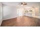 Inviting living room featuring new wood-look floors and a view of the kitchen at 9413 Stonewall Ln, New Port Richey, FL 34655