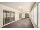 Large sunroom features multiple sliding glass doors and windows at 9413 Stonewall Ln, New Port Richey, FL 34655