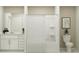 This bathroom features a sleek vanity and a shower-tub combination at 10210 Purple Leaf Ct, Riverview, FL 33578