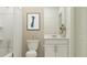 Bright bathroom featuring white vanity, framed art, and shower with curtain at 10210 Purple Leaf Ct, Riverview, FL 33578