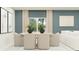 Bright dining room features modern decor, a large window, and an elegant neutral color palette at 10210 Purple Leaf Ct, Riverview, FL 33578