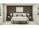 Main bedroom features a neutral color scheme, a bed with multiple pillows, and a bench seat at the foot of the bed at 10210 Purple Leaf Ct, Riverview, FL 33578