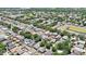 Aerial view of a lush suburban community with winding roads, green trees, and well-maintained properties at 10409 Fly Fishing St, Riverview, FL 33569
