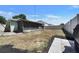 Backyard with patio, green house, and privacy fence at 10409 Fly Fishing St, Riverview, FL 33569