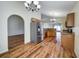 Modern kitchen featuring stainless steel refrigerator, granite countertops, and wood cabinets at 10409 Fly Fishing St, Riverview, FL 33569