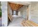 Unfinished basement featuring concrete block walls, a concrete floor, and exposed ceiling joists at 110 W Hiawatha St, Tampa, FL 33604