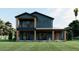 An appealing two-story home with covered front porch, wooden pillars, and a well-maintained lawn at 110 W Hiawatha St, Tampa, FL 33604