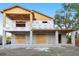 New home construction with exterior wall framing, sheathing and visible concrete block foundation at 110 W Hiawatha St, Tampa, FL 33604