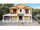 New construction featuring unfinished exterior and visible concrete block foundation in a residential neighborhood at 110 W Hiawatha St, Tampa, FL 33604