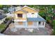 New home construction showcasing the framed exterior, sheathing, partial roofing, and surrounding neighborhood at 110 W Hiawatha St, Tampa, FL 33604