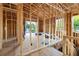 Second floor interior framing featuring studs, sheathing, and exposed beams; construction phase at 110 W Hiawatha St, Tampa, FL 33604