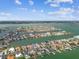 A captivating overhead perspective of waterfront houses with docks that weave through an expansive water system at 11340 5Th E St, Treasure Island, FL 33706