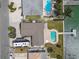 Aerial shot of a home with a large backyard, in-ground pool, and dock, showcasing waterfront living at 11340 5Th E St, Treasure Island, FL 33706