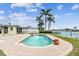 Sparkling backyard pool with patio, offering serene waterfront views at 11340 5Th E St, Treasure Island, FL 33706