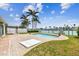 Backyard pool with patio overlooking the waterfront, ideal for entertaining at 11340 5Th E St, Treasure Island, FL 33706