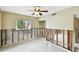 Bedroom with bare walls, fan, window, and view to closet and hall at 11340 5Th E St, Treasure Island, FL 33706