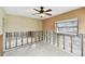 Bright, spacious bedroom featuring exposed concrete block and a ceiling fan at 11340 5Th E St, Treasure Island, FL 33706