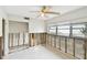 Bedroom with bare walls, fan, window, and view to closet and hall at 11340 5Th E St, Treasure Island, FL 33706
