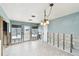Bright dining area with tile floors, an open layout, and natural light, offering potential for customization at 11340 5Th E St, Treasure Island, FL 33706