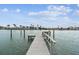 Waterfront home featuring a private wooden dock that extends into the tranquil bay waters at 11340 5Th E St, Treasure Island, FL 33706