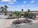 Aerial view of a single-story home featuring lush landscaping and a circular driveway at 11340 5Th E St, Treasure Island, FL 33706