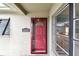 Exterior front door featuring glass panes, decorative transom window, and prominent address number at 11340 5Th E St, Treasure Island, FL 33706