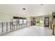 Spacious living area needing renovation, neutral tile flooring and window at 11340 5Th E St, Treasure Island, FL 33706