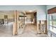 Wide-open floor plan featuring light tile flooring, renovation needed at 11340 5Th E St, Treasure Island, FL 33706