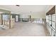 Renovation-ready living room with tile floors and open floor plan at 11340 5Th E St, Treasure Island, FL 33706