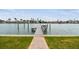 Waterfront dock with a seating area, providing stunning views and relaxation at 11340 5Th E St, Treasure Island, FL 33706