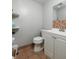 Bathroom featuring a toilet and a single sink vanity with ample countertop space at 11708 Raintree Village Blvd # A, Temple Terrace, FL 33617