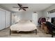 Bedroom showcasing a king bed, closet, and an adjacent bathroom with a shower at 11708 Raintree Village Blvd # A, Temple Terrace, FL 33617