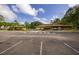 Community clubhouse featuring ample parking, convenient accessibility, and well-maintained landscaping at 11708 Raintree Village Blvd # A, Temple Terrace, FL 33617