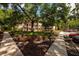 Exterior grounds and entryway of a two-story condo building landscaped with mature trees at 11708 Raintree Village Blvd # A, Temple Terrace, FL 33617